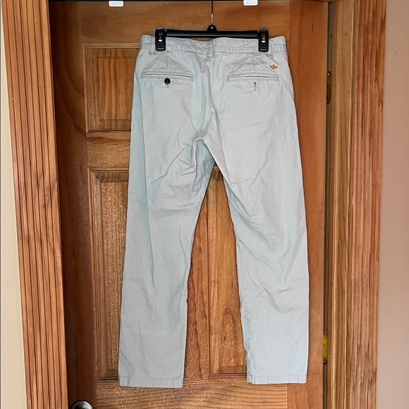 Dockers Men's khaki color one mark on them near hem. Picture attached. - Picture 2 of 5